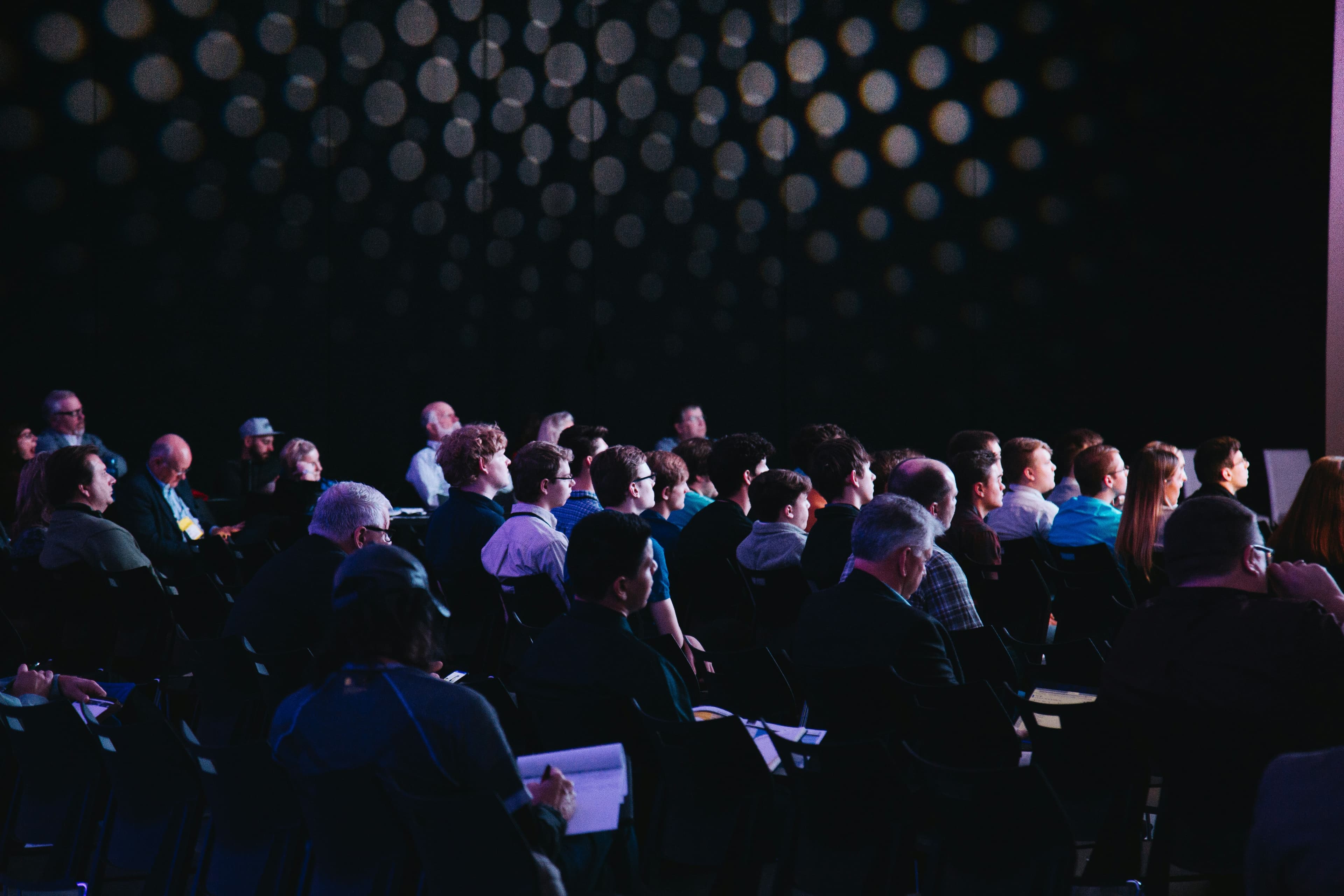 An event where people sit looking at the presentation.